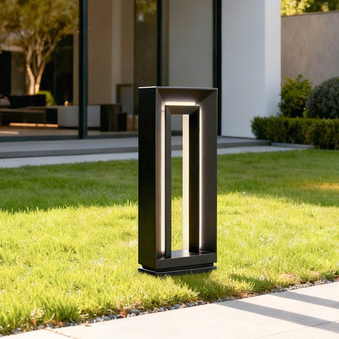 Residential garden entrance enhanced with warm-glow lighted bollards LED providing modern landscape lighting.