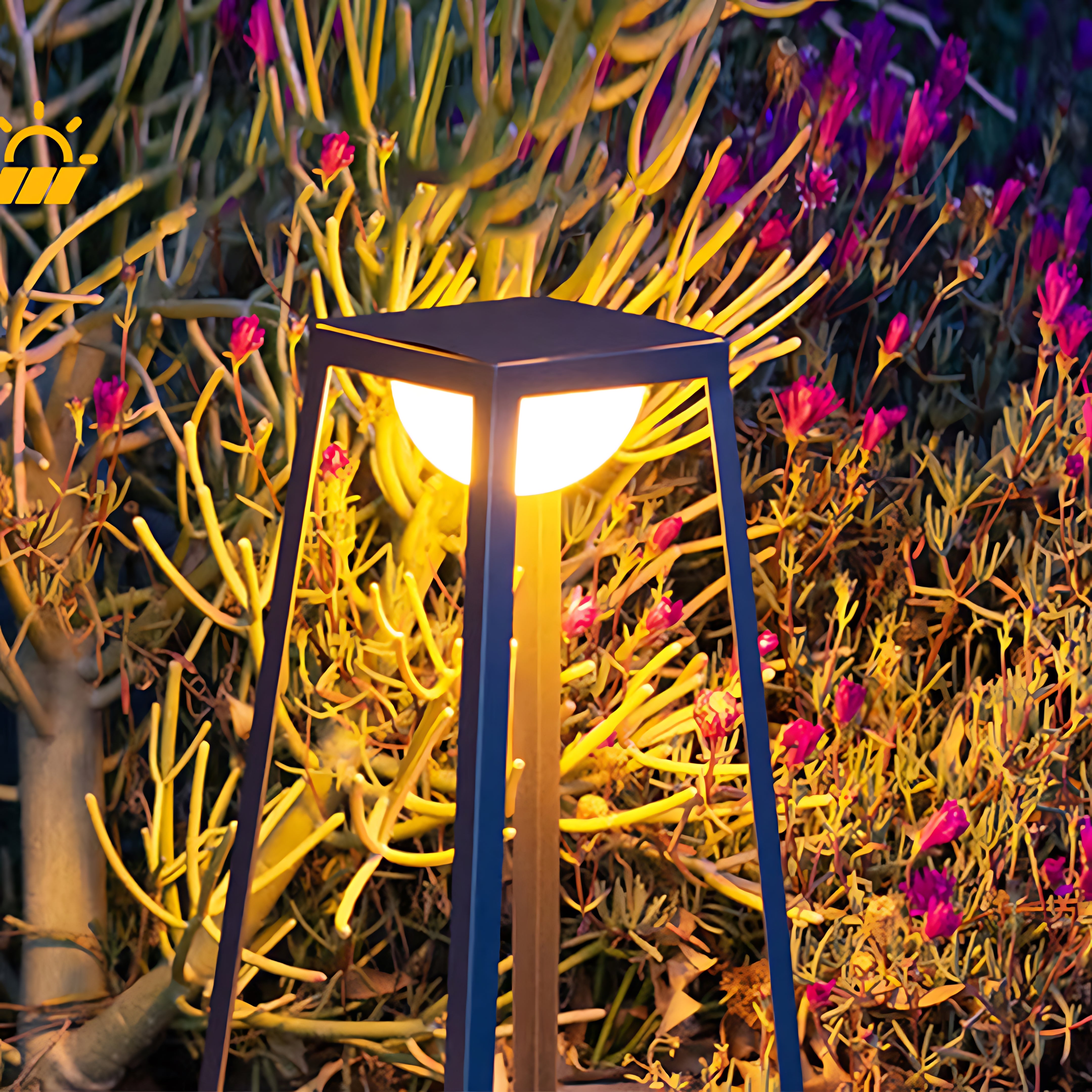 Tall garden lantern highlighting colorful ornamental plants with dramatic uplighting effect