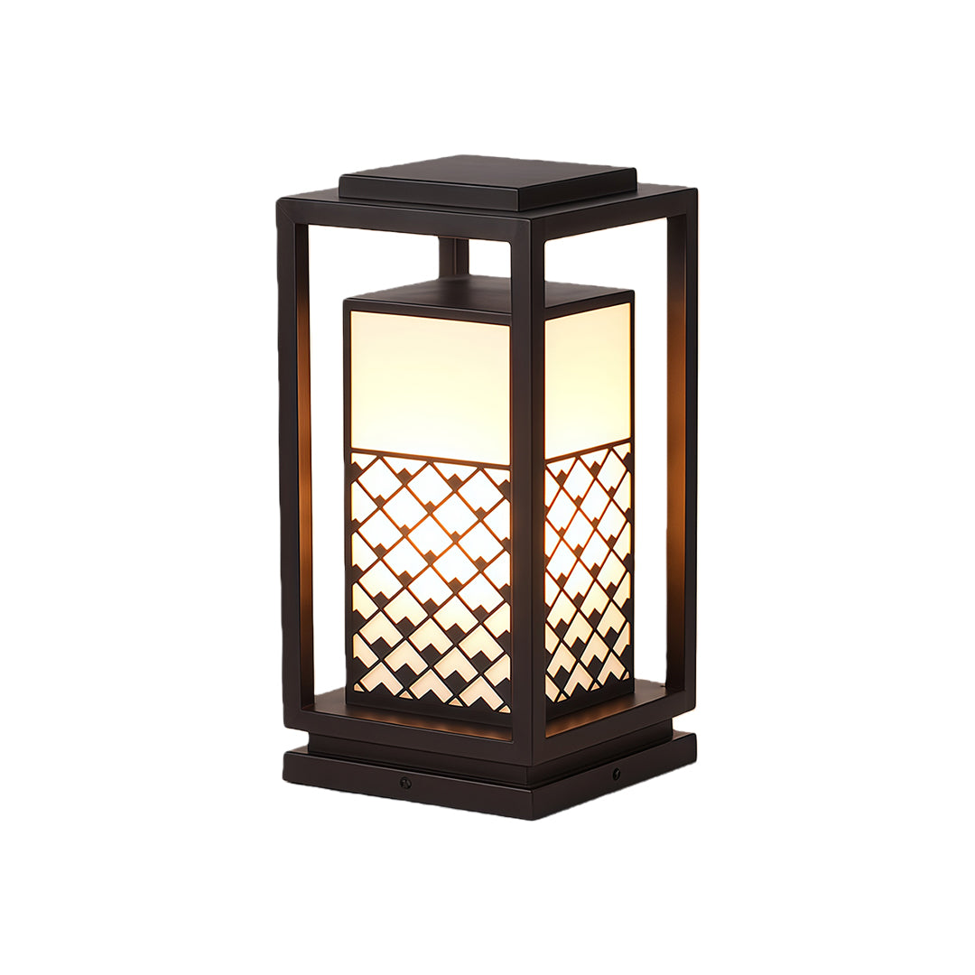 Bollard light fixture placed along a garden path, offering elegant lighting and decorative appeal with its unique design.