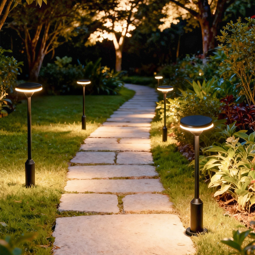 garden path lighting illuminating forest walkway with multiple posts creating warm ambiance
