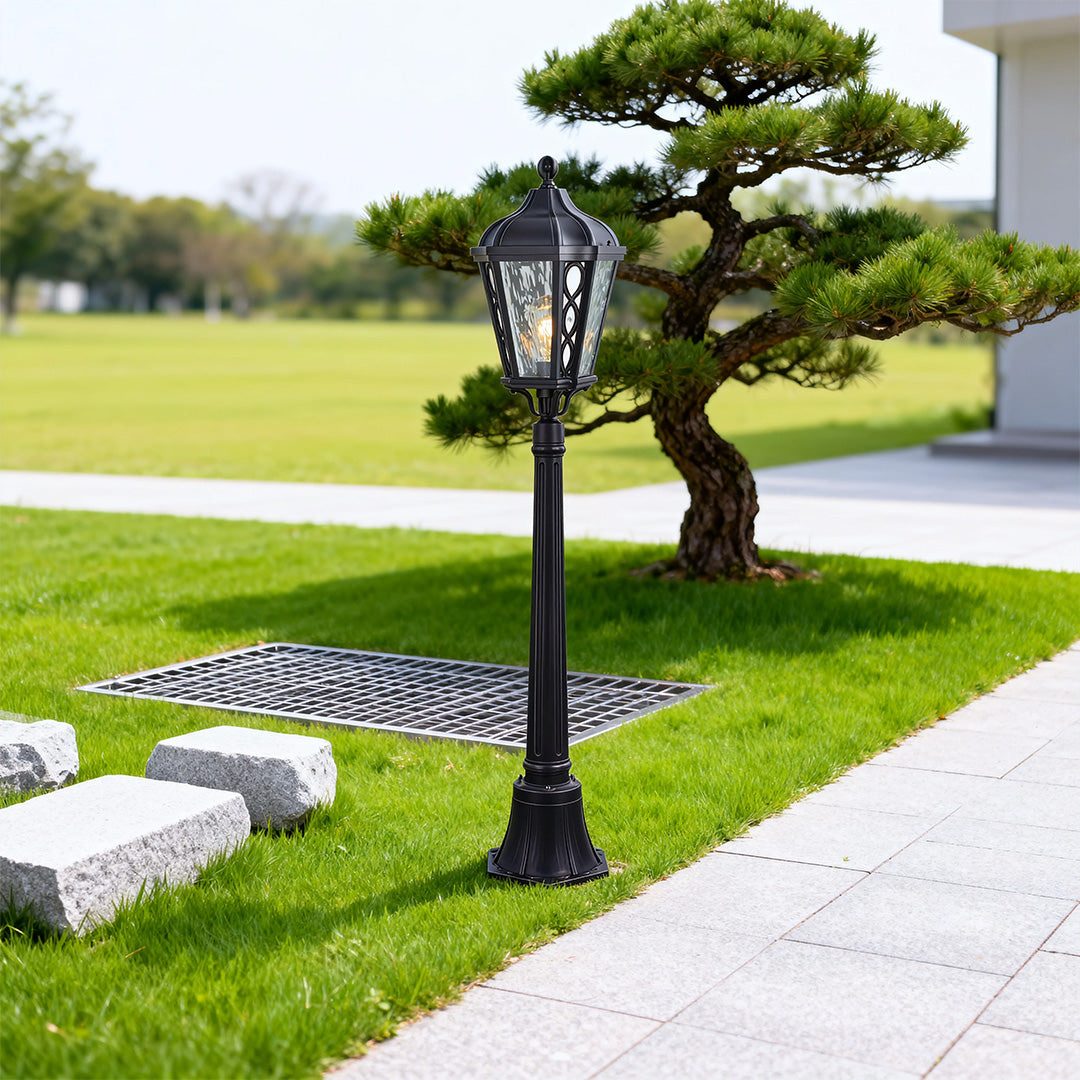 Bollard light along a garden pathway, elegant and functional outdoor lighting fixture