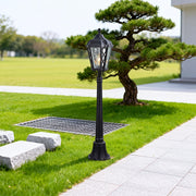 Bollard light along a garden pathway, elegant and functional outdoor lighting fixture