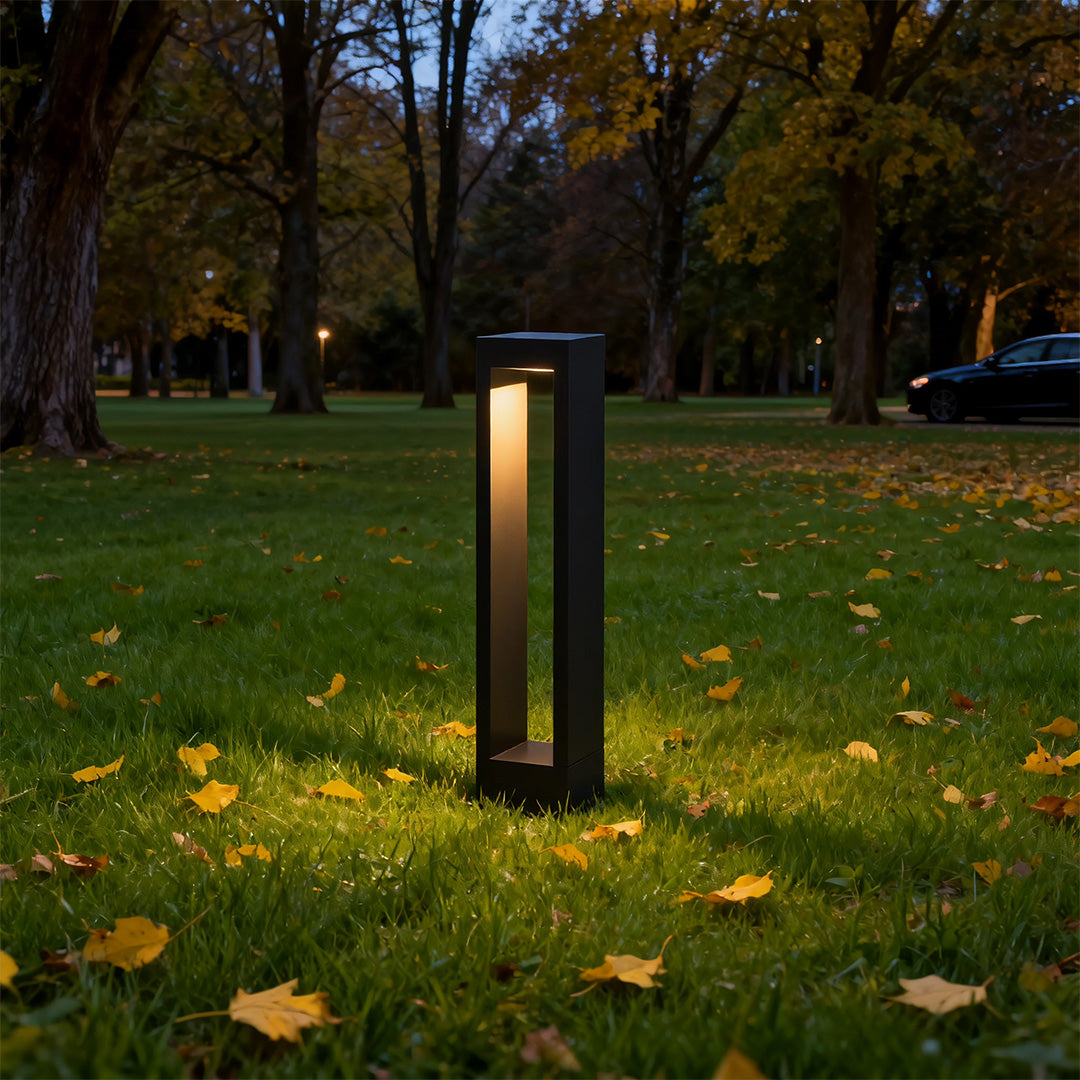 Garden pathway light along a modern building's pathway, offering stylish and functional lighting.