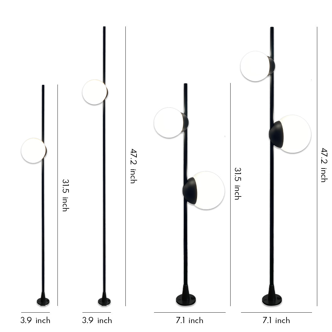 Minimal black pole lights with round heads arranged in varying heights, designed to provide soft garden pathway lighting in modern outdoor spaces.