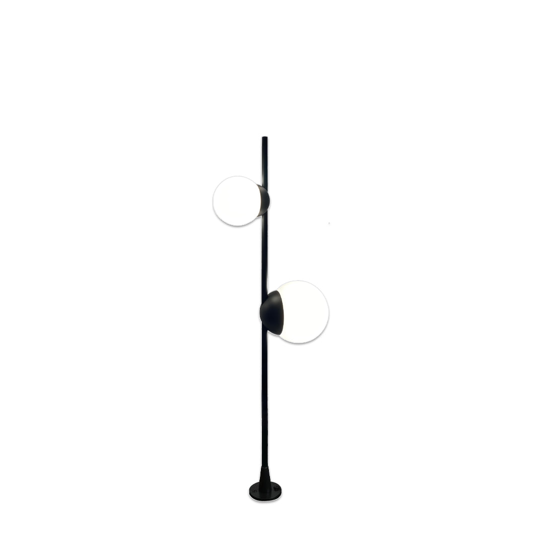 A modern black pathway fixture with a small rounded head mounted on a slim pole, suitable for soft garden pathway lighting.