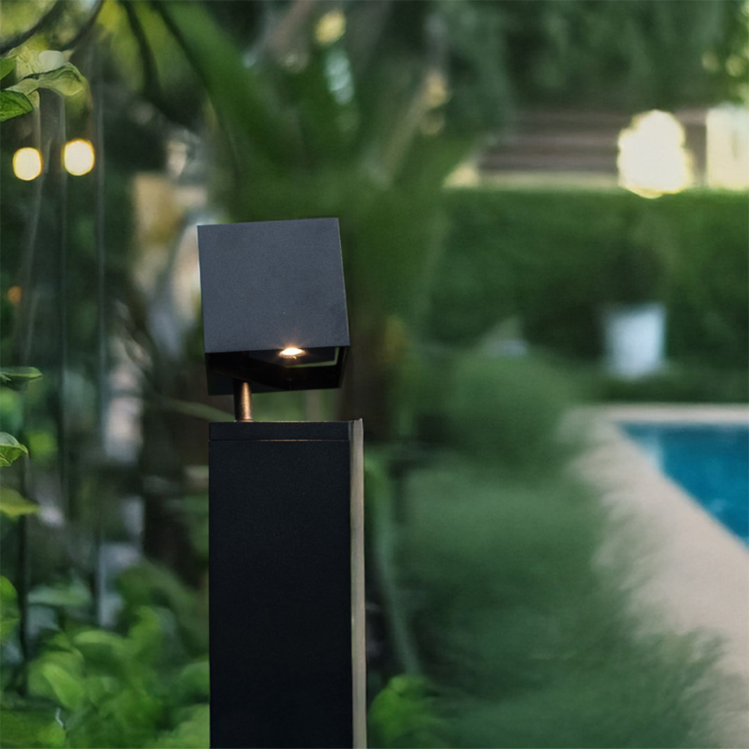 Pathway outdoor lights creating elegant illumination in lush garden setting with natural landscaping