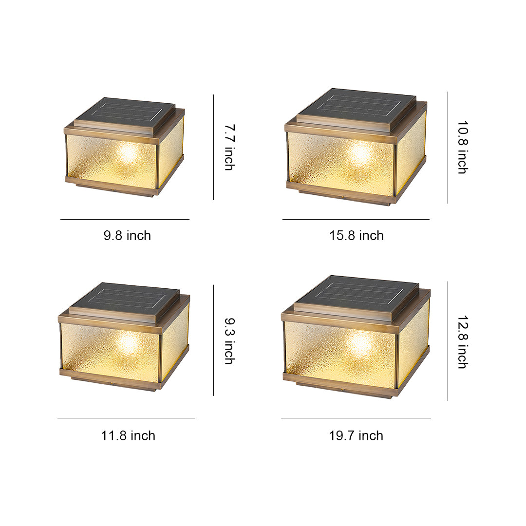 Garden pillar lights design reference showing four amber-glowing square post lamps with textured glass panels