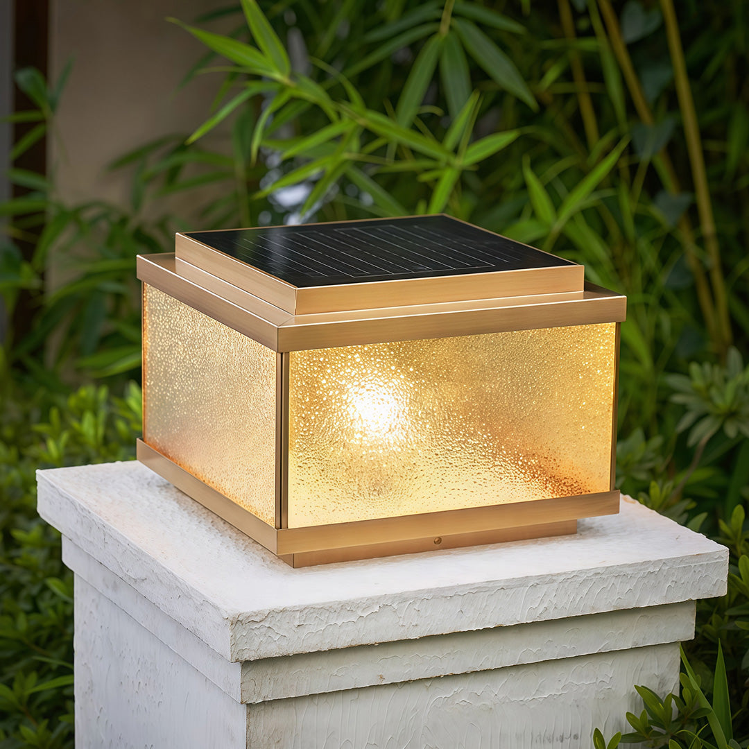 Garden pillar lights installed on stone column beside brick pathway creating elegant entrance lighting