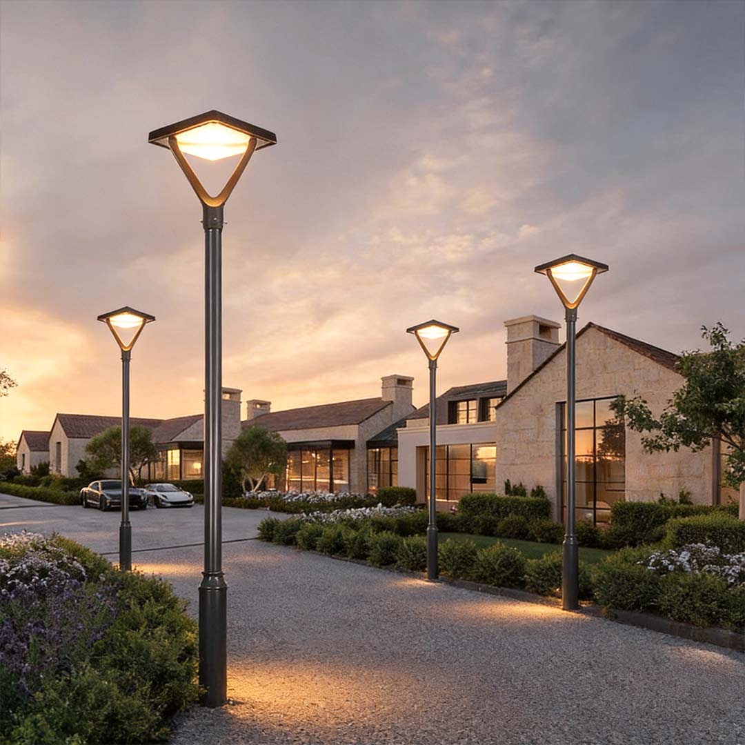 Garden street light with a modern design, providing bright light along a gravel path.