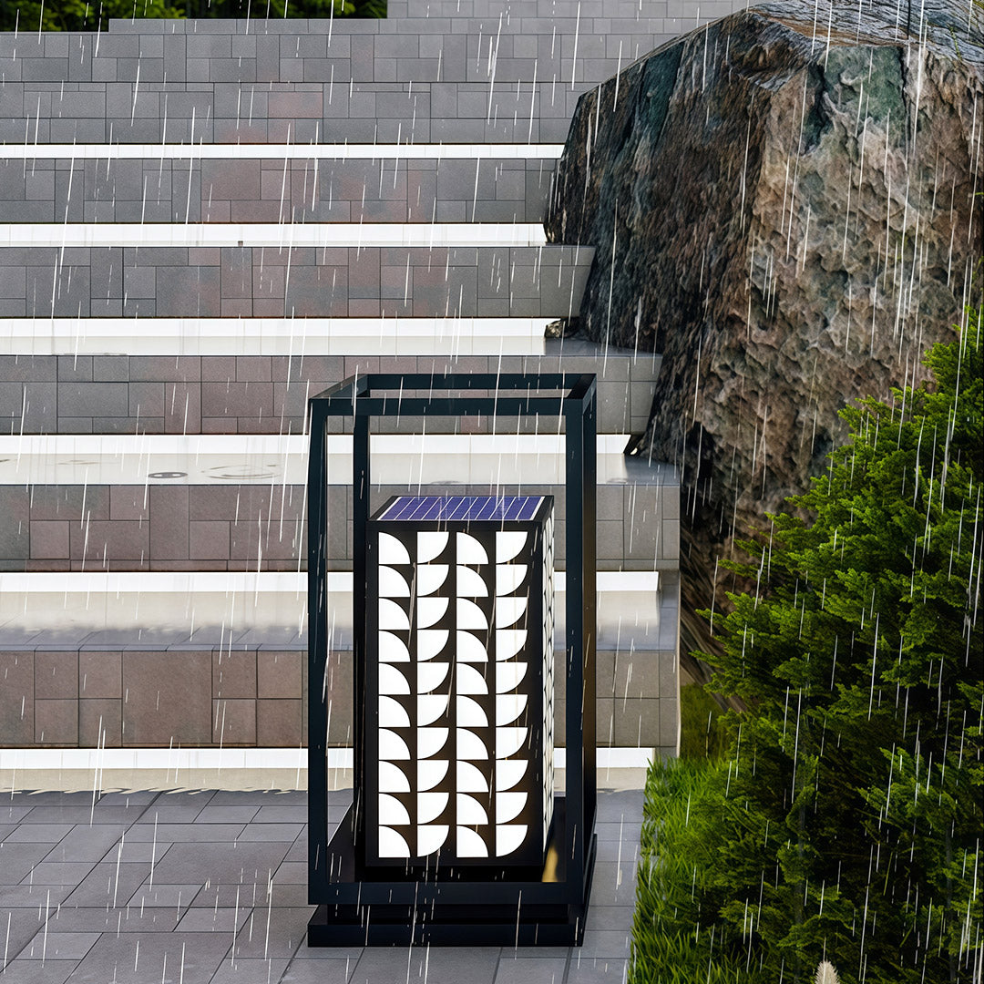 LED bollard light beside a garden water feature, combining functionality with a decorative design.