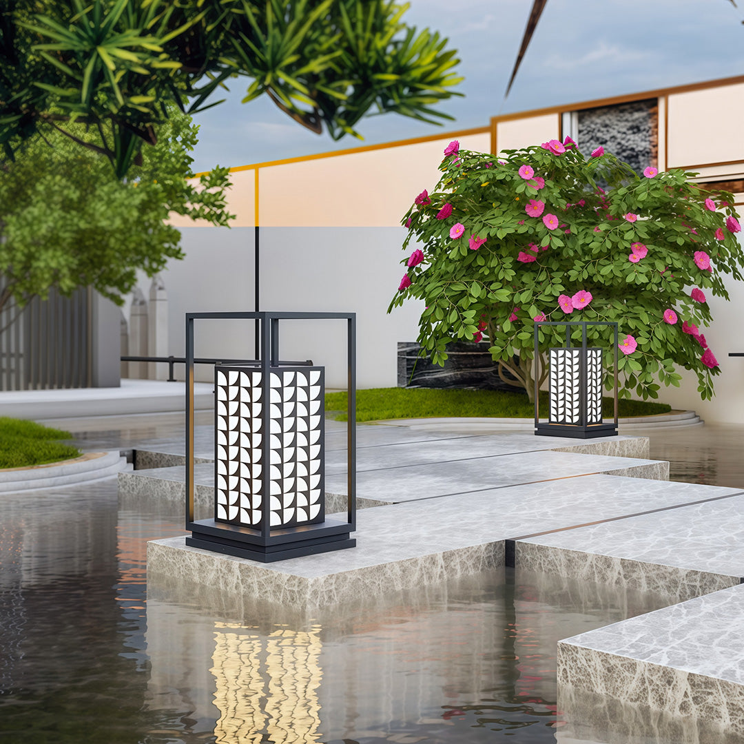 LED bollard light beside a garden water feature, combining functionality with a decorative design.