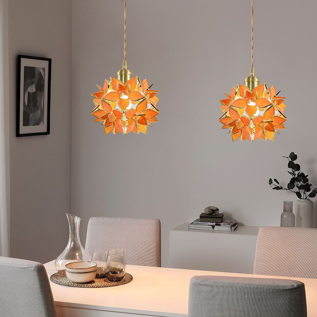Gardenia pendant light providing soft illumination above a stylish living room.