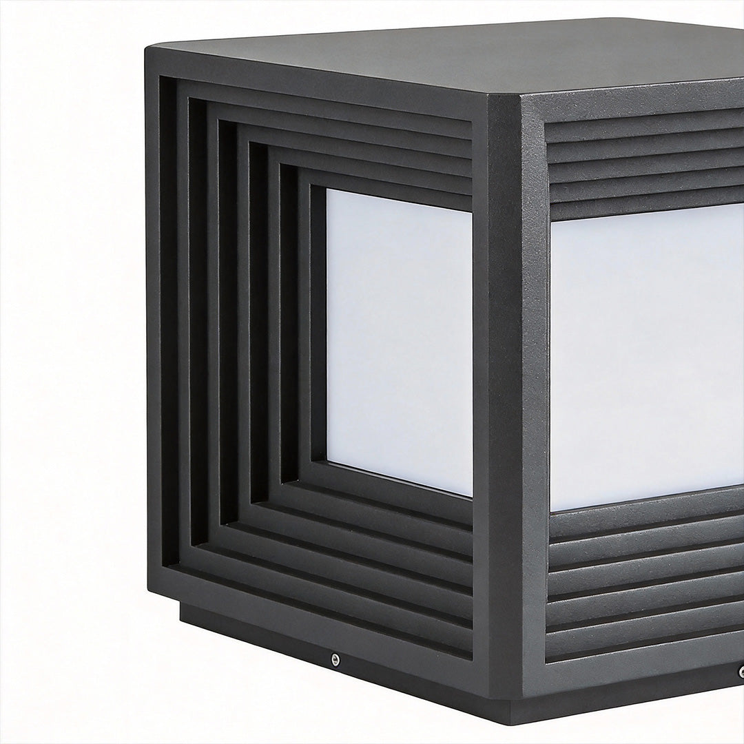 Gate pillar lights with a clean, modern look, installed on a black fence.