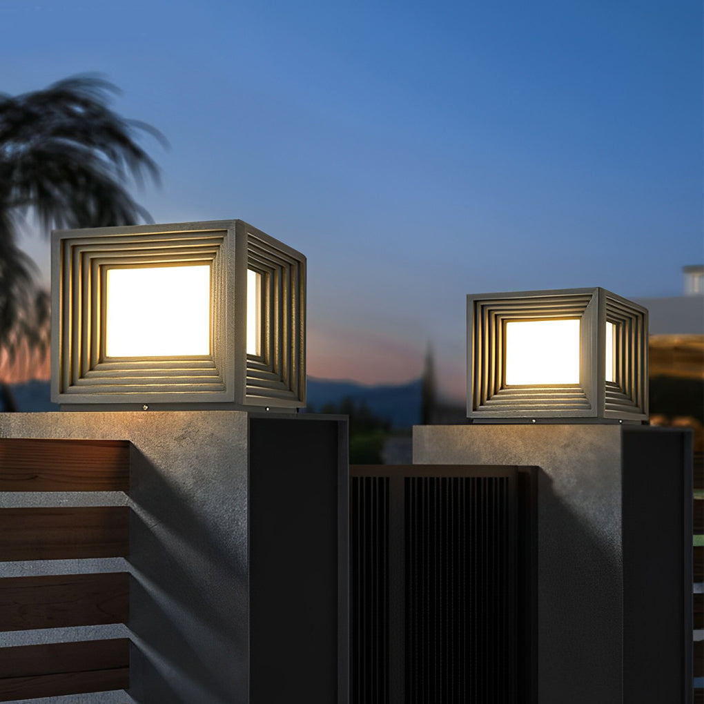 Gate pillar lights with a contemporary design, enhancing a garden fence at twilight.