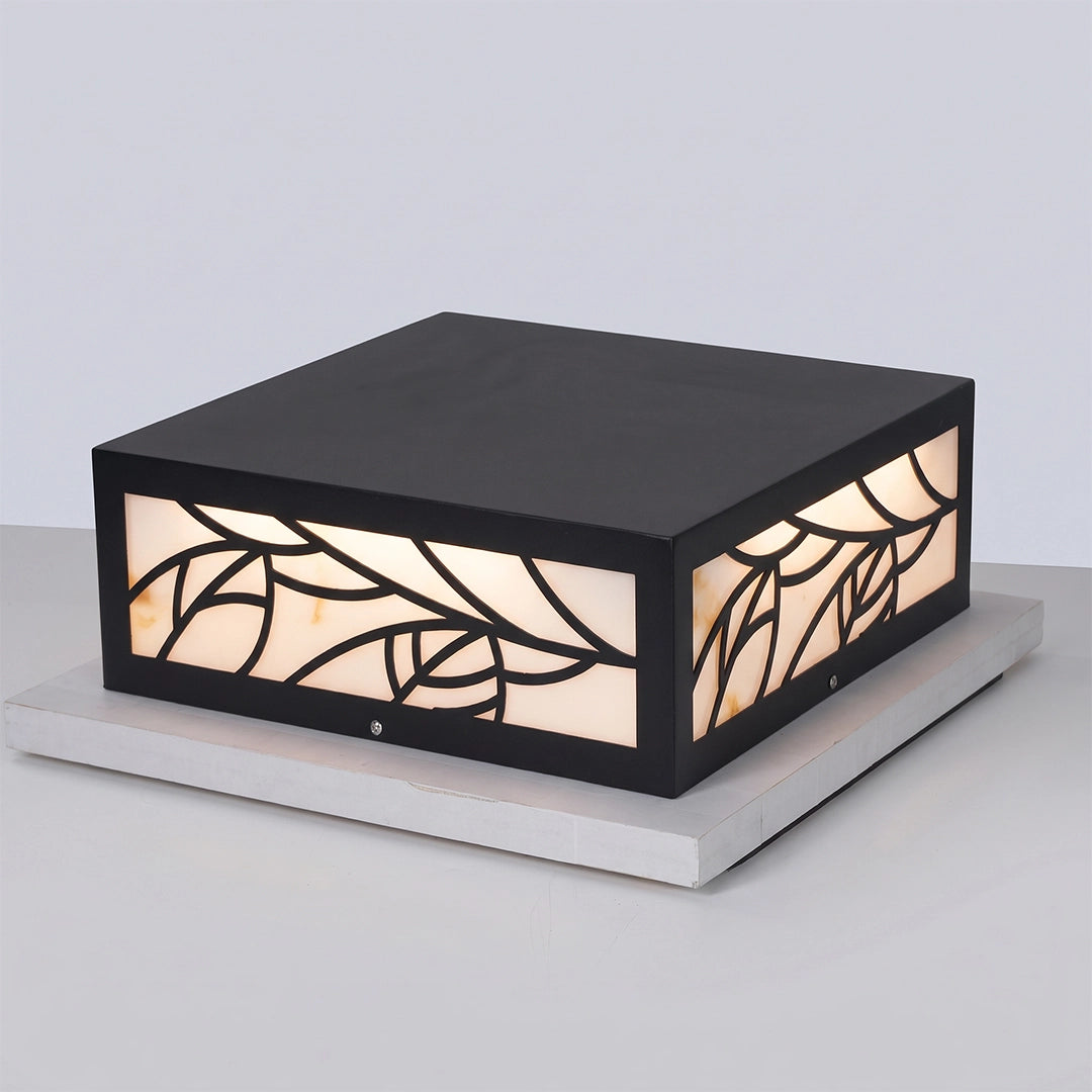 Gate pillar light with a black square frame and decorative patterned panels shown on white.