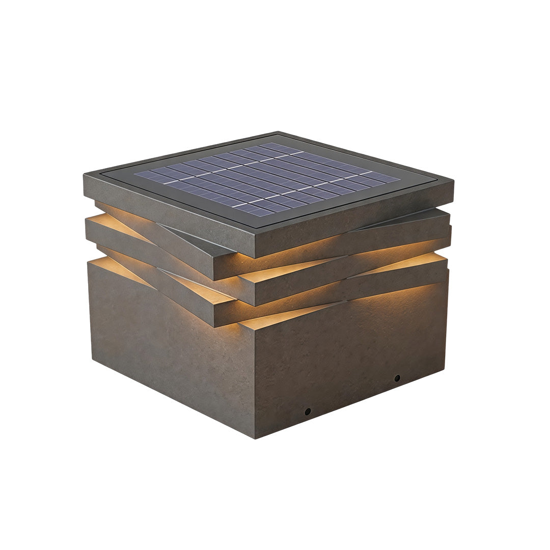 Gate post solar pillar light with integrated solar panel and modern stacked outdoor lighting structure.