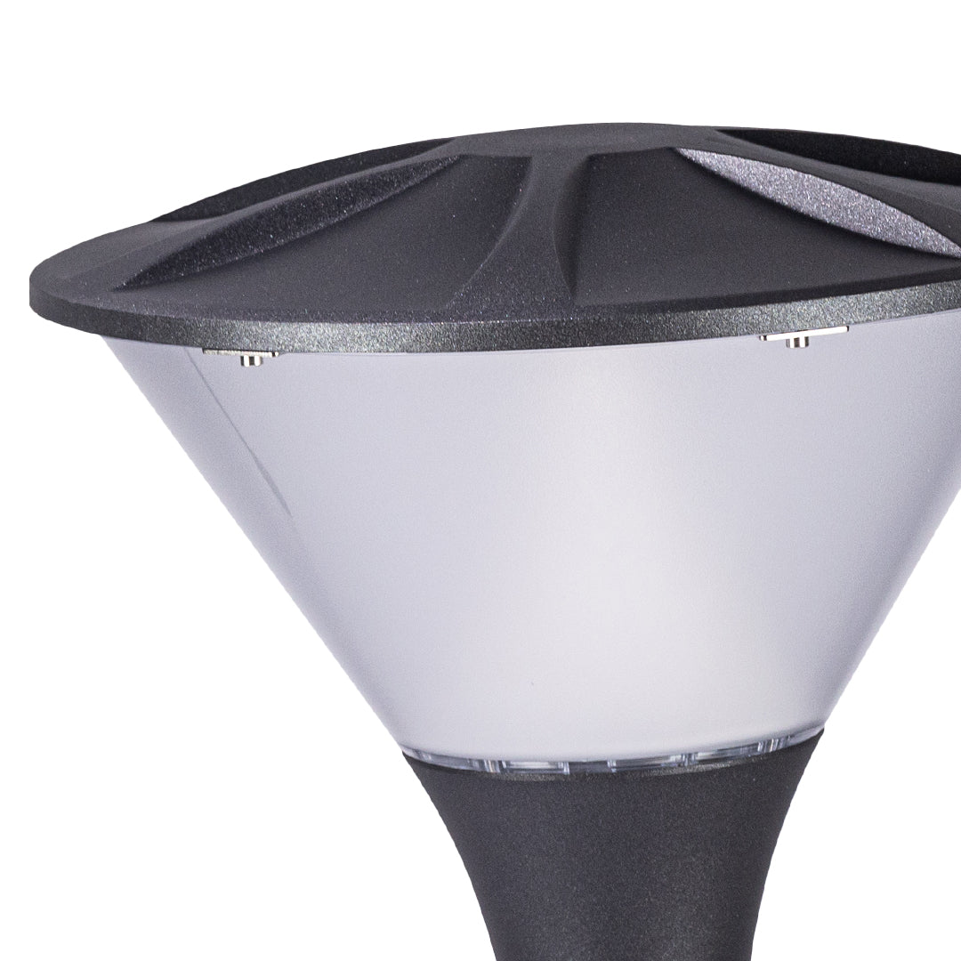 Close-up view of white and black geometric bollard light showing detailed construction and finish