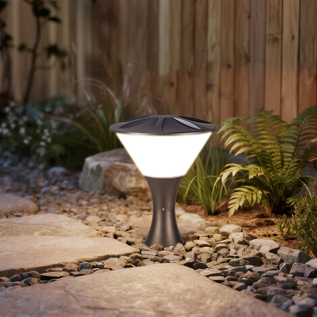 Stylish geometric bollard light fixture enhancing outdoor patio area with modern architectural elements