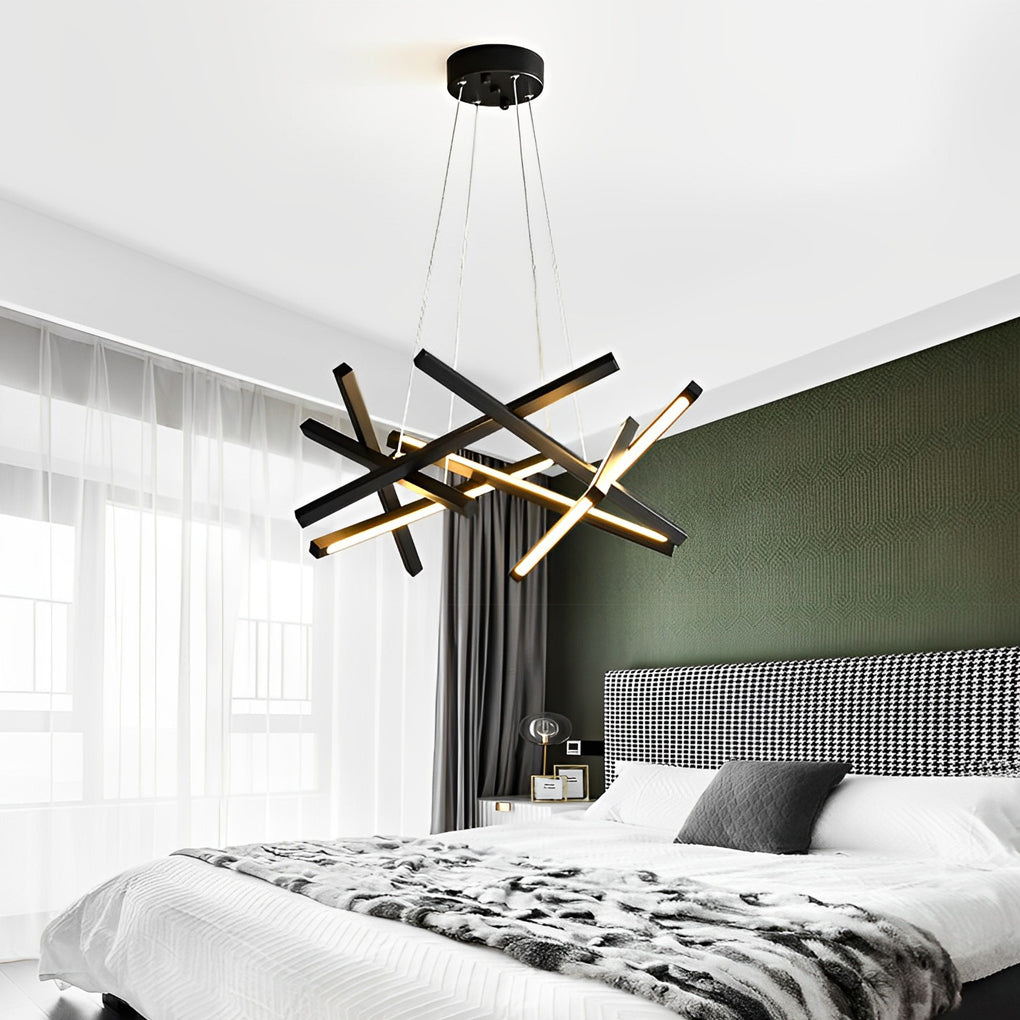 Modern geometric ceiling light with black and gold LED lines in a bedroom setting, enhancing depth and visual interest overhead.