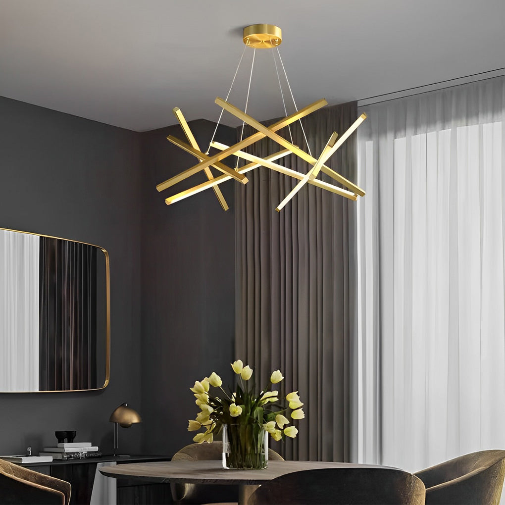 Geometric ceiling light with gold linear LED bars suspended in a modern living room, creating an artistic focal point and warm ambient glow.