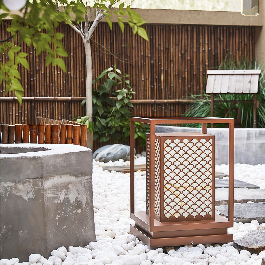 Bollard light with geometric design providing stylish illumination for outdoor settings like patios or walkways.