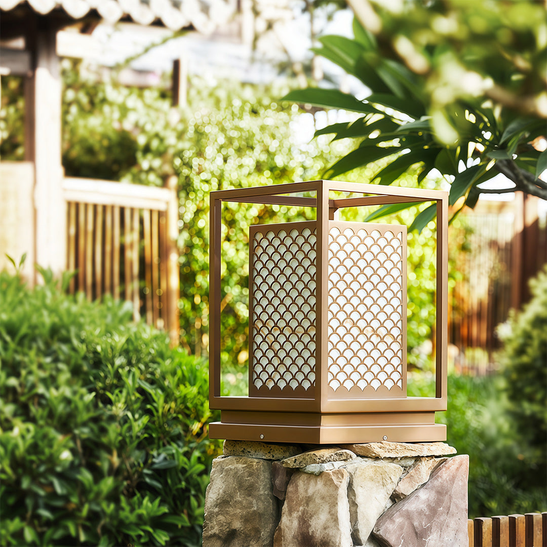 Bollard light with geometric design providing stylish illumination for outdoor settings like patios or walkways.