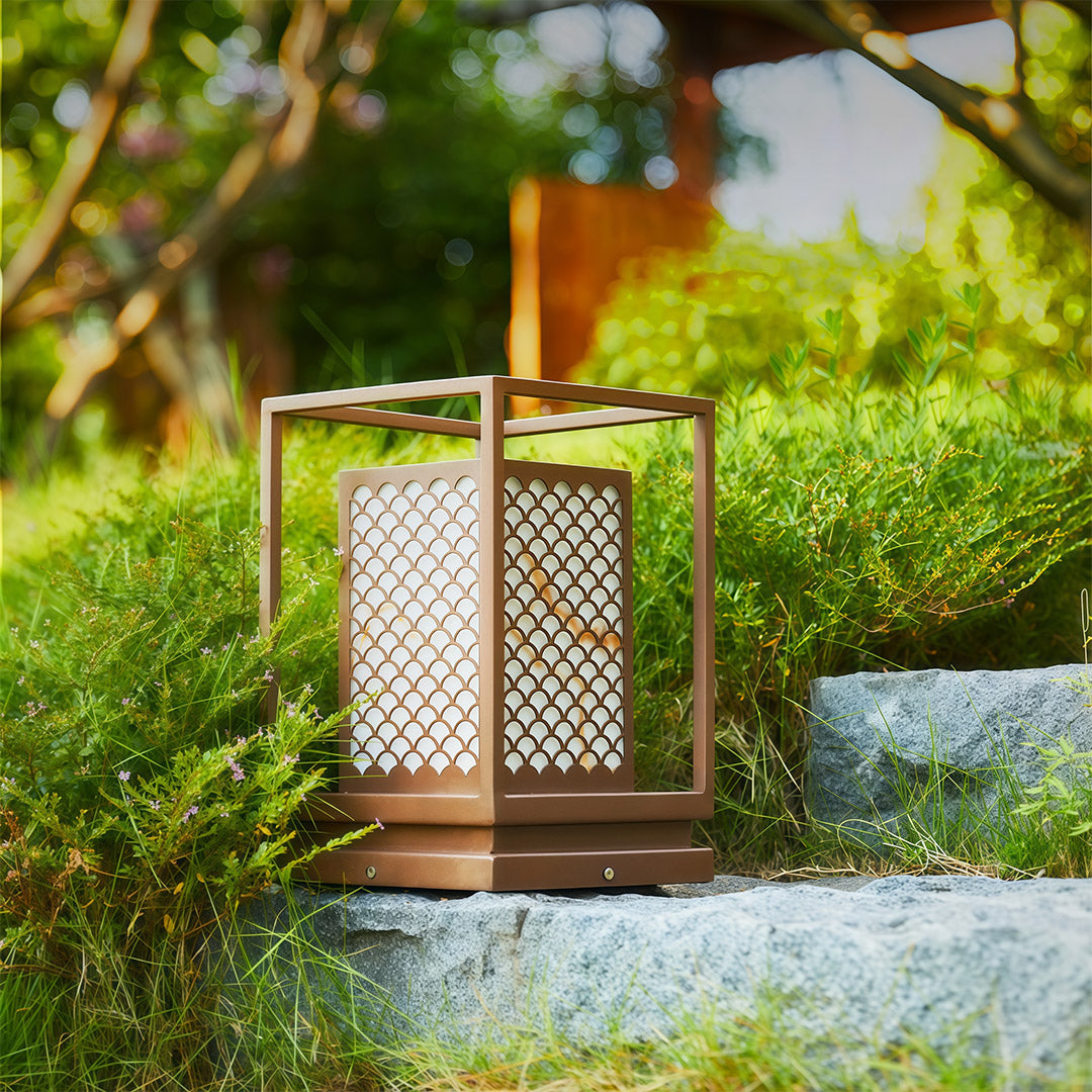 Bollard light with geometric design providing stylish illumination for outdoor settings like patios or walkways.