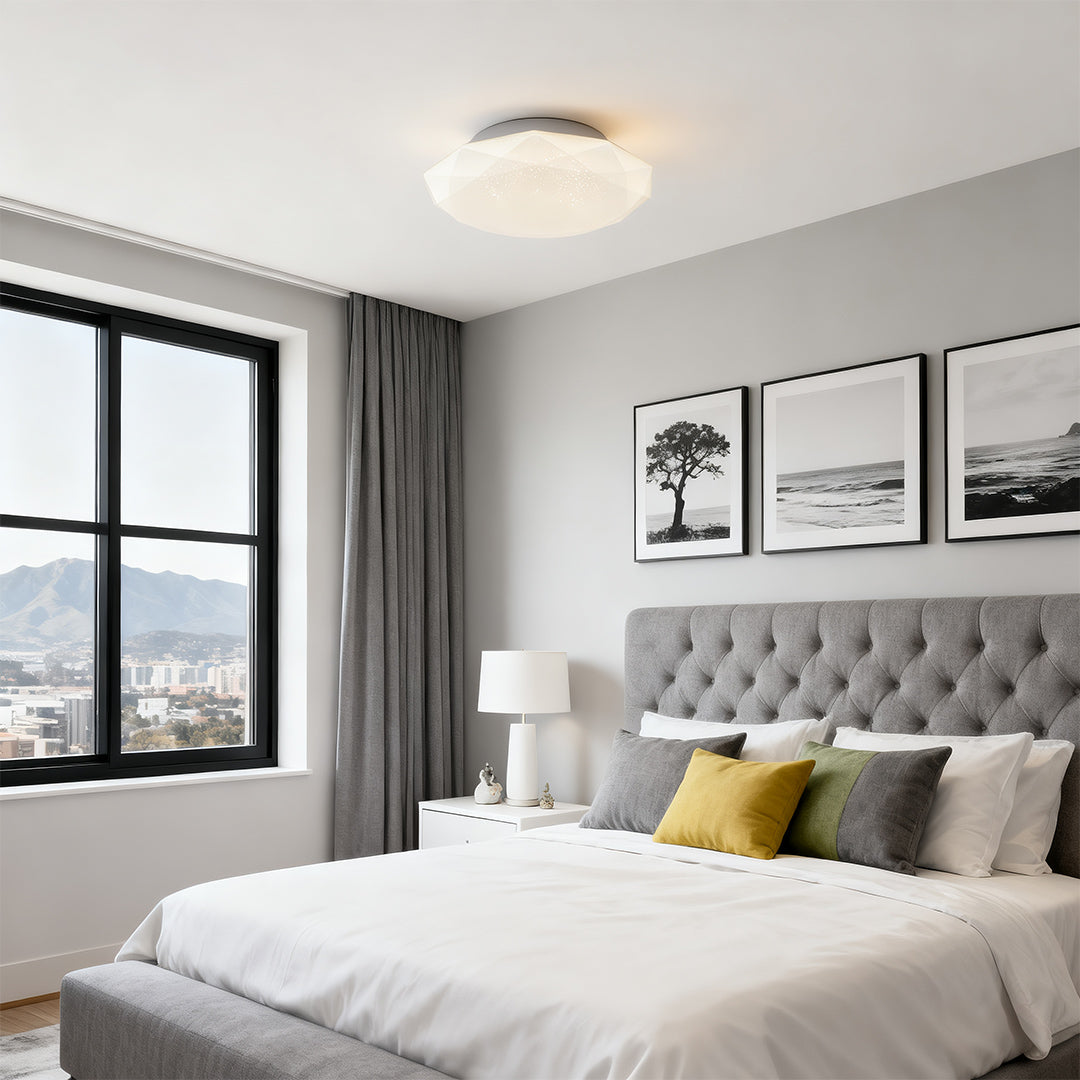 Contemporary geometric flush mount ceiling light adding warmth to a cozy white bedroom.