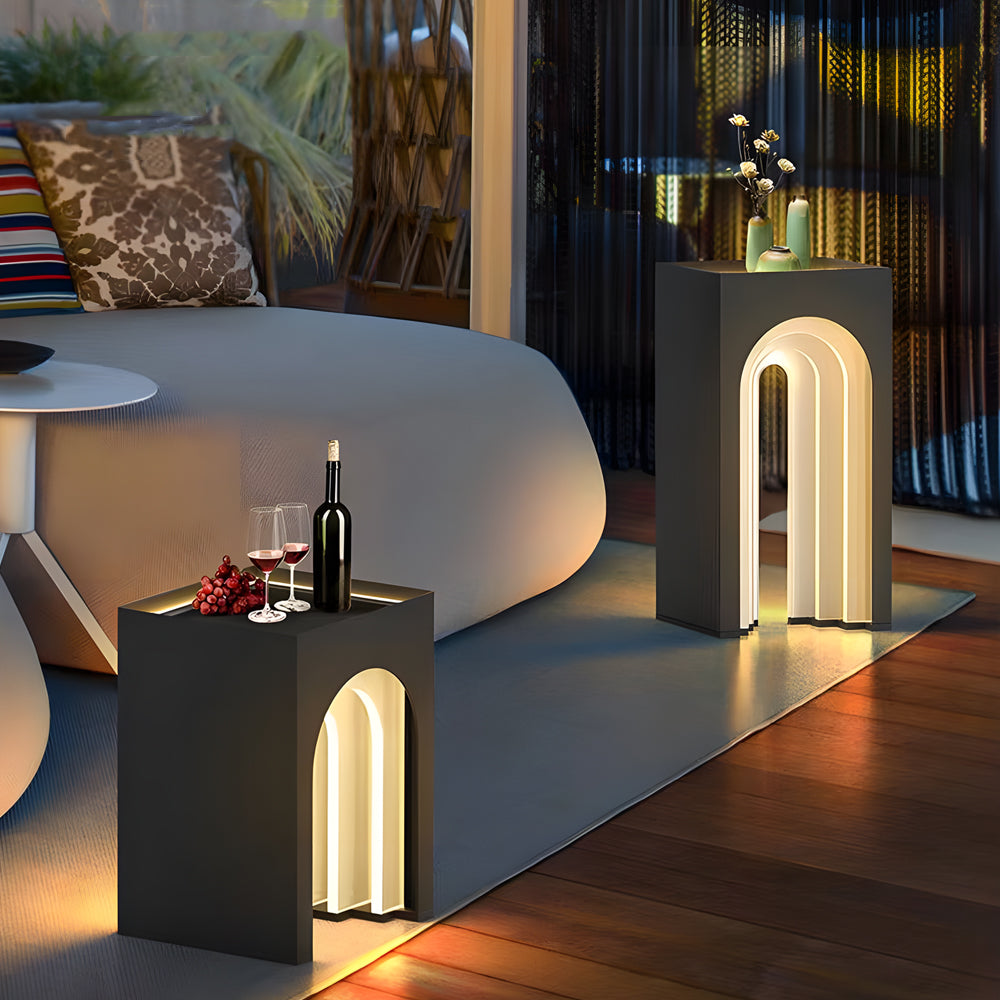 Contemporary lighted lawn decorations featuring geometric metal pillars with integrated LED strips for modern garden lighting