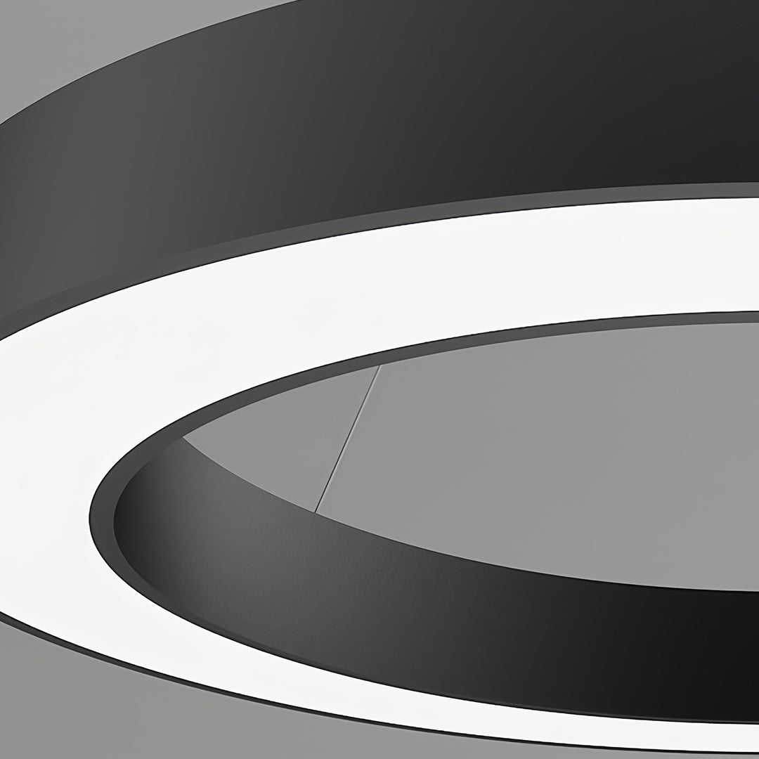 Close-up detail of geometric pendant light showing black and white circular contrast design