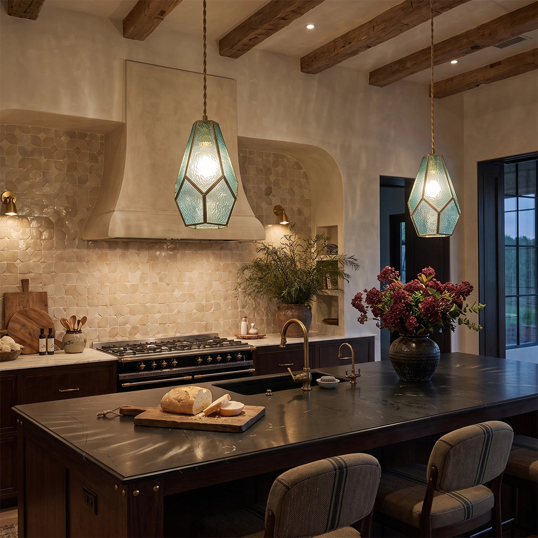 Blue geometric pendant light hanging above a kitchen island in a warm modern kitchen.