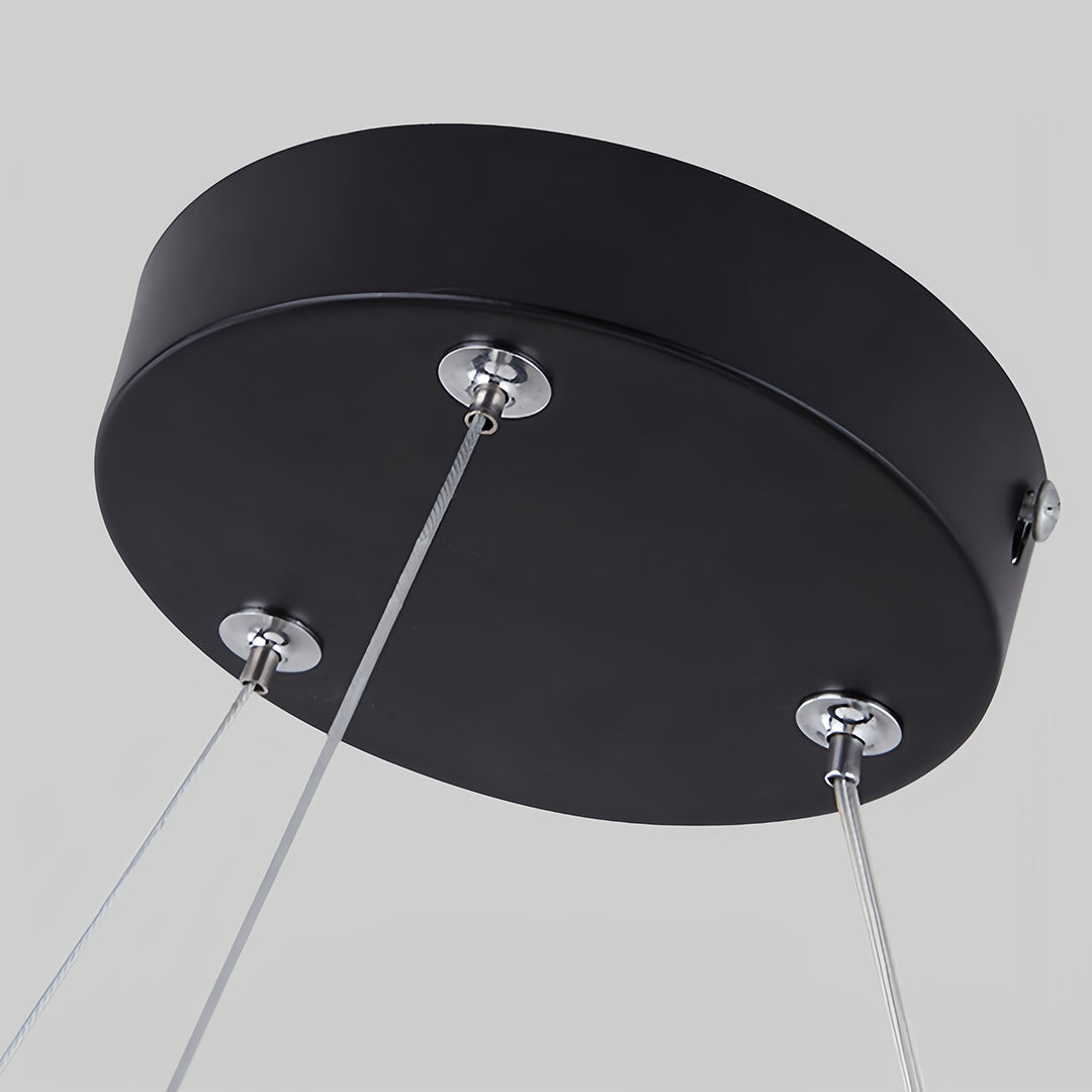 Top view of geometric pendant light revealing suspension cables and circular canopy mounting