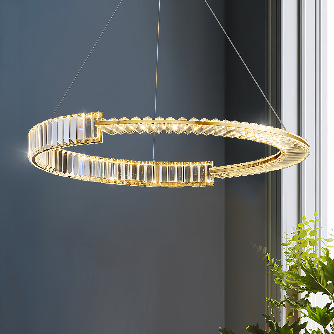Modern gold crystal chandelier with geometric ring pattern in contemporary living environment