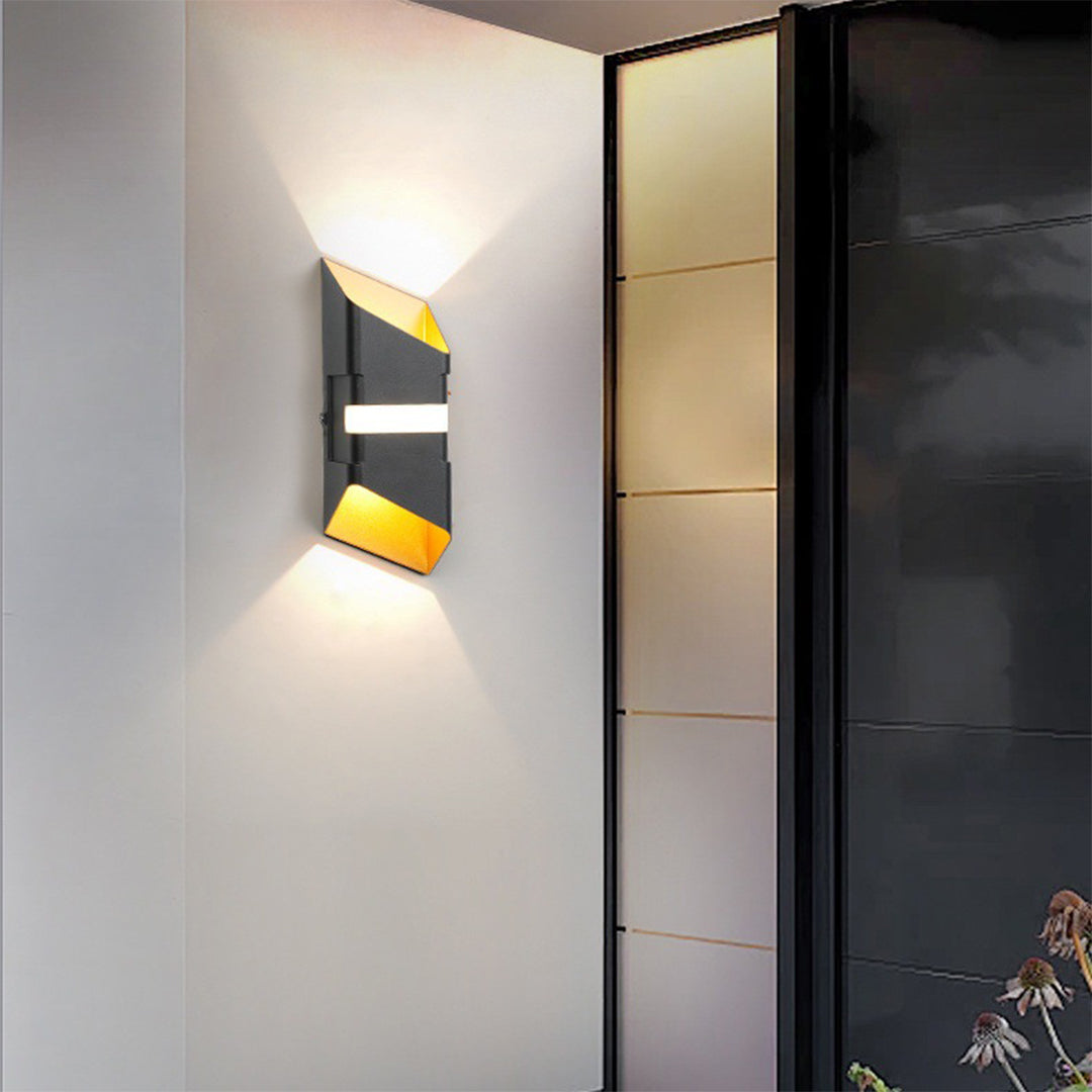 Illuminated geometric wall light installed in modern hallway creating dramatic lighting effects