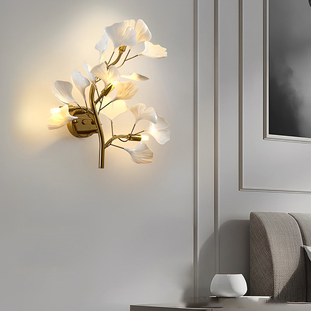 Ginkgo wall light illuminating a minimalist interior with artistic leaf design.