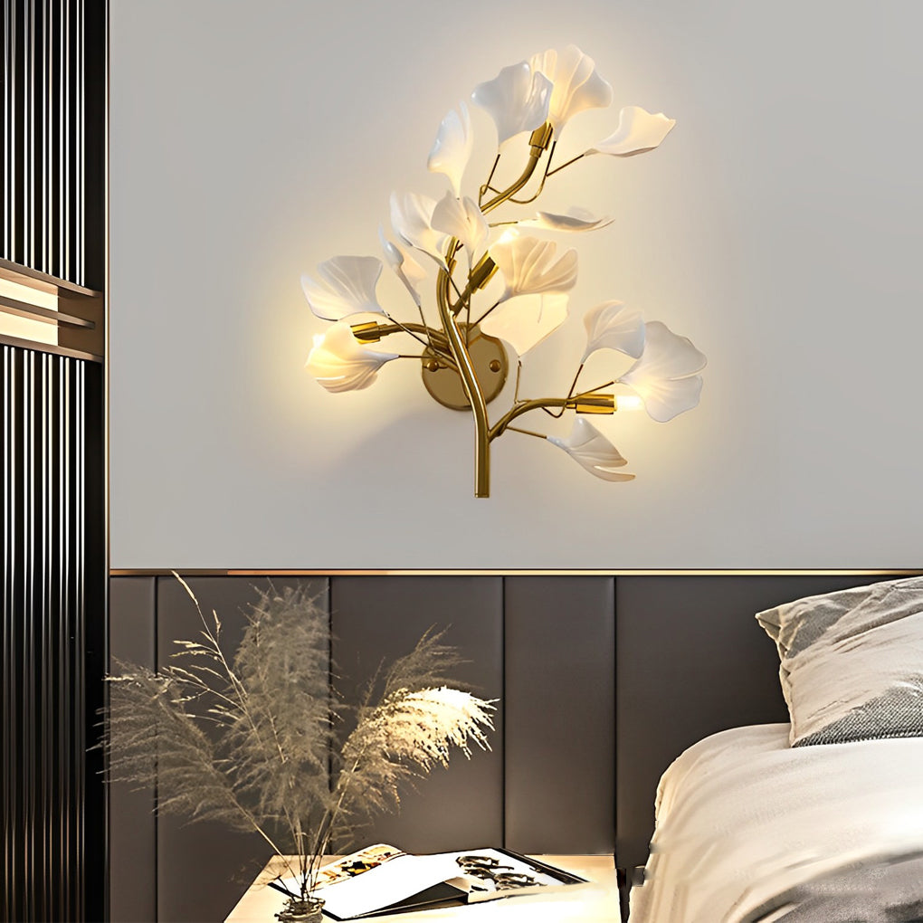Ginkgo wall light providing soft illumination in a stylish bedroom setting.