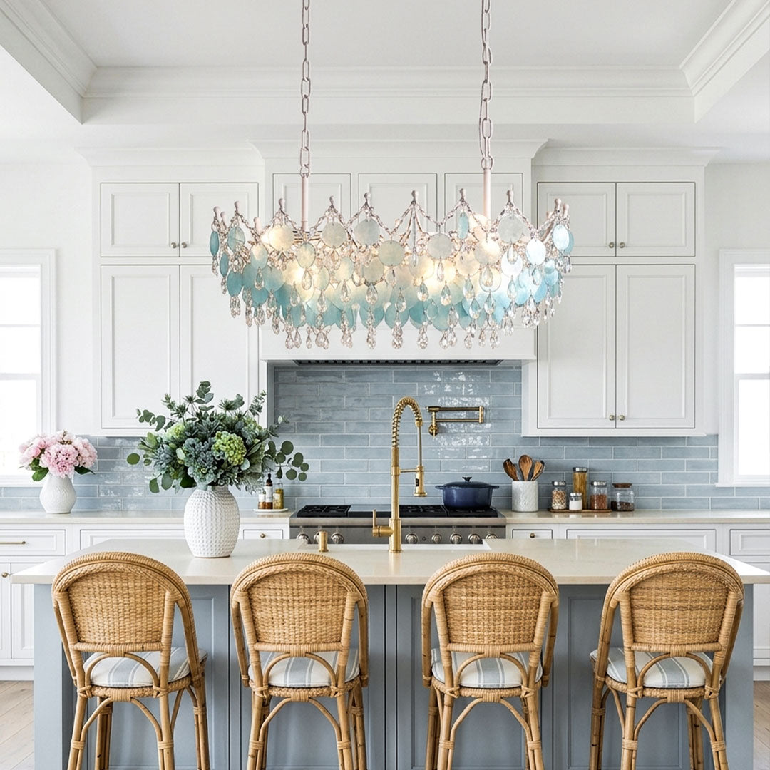 Glam chandelier installed above a kitchen island with layered crystal and glass accents.