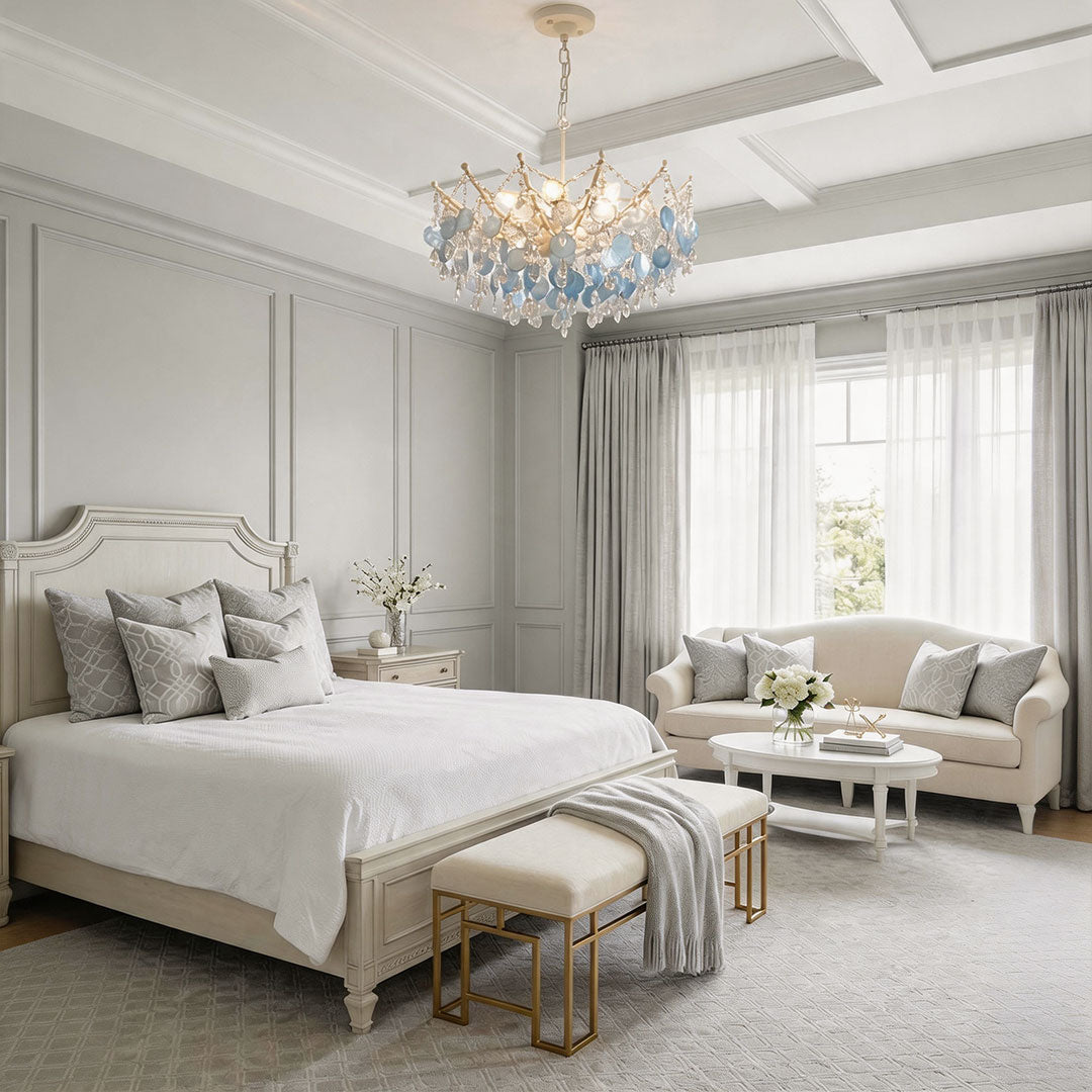 Glam chandelier creating a luxurious centerpiece in a contemporary bedroom.