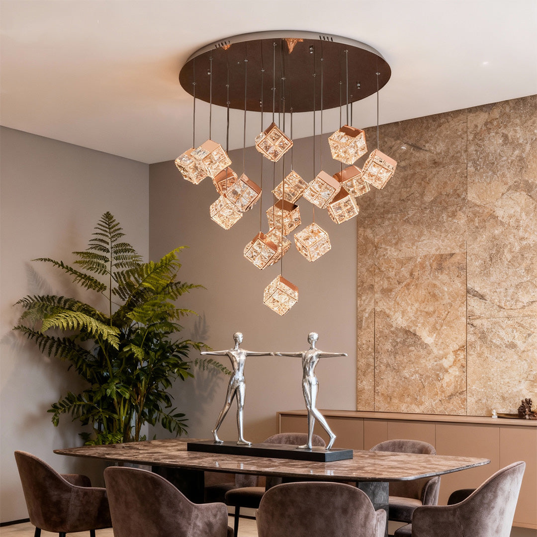 Glamorous chandelier with crystals and glass shade chandelier aesthetic providing warm ambient lighting in luxurious brown-toned dining space.