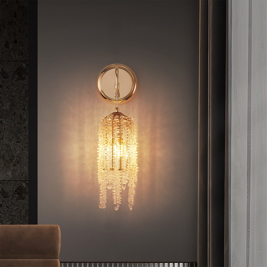 Glamorous wall lights with crystals and glass shade chandelier styling creating ambient glow on dark accent wall in modern space.