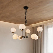 Glass ball chandelier modern featuring multiple frosted globe lights in a stylish contemporary living room.