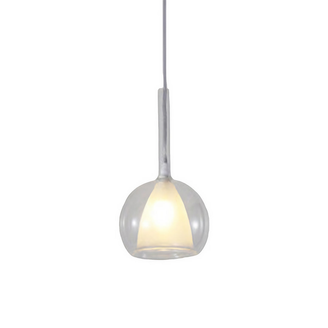 Glass ball pendant light hanging from a ceiling, providing a minimalist and chic lighting solution.