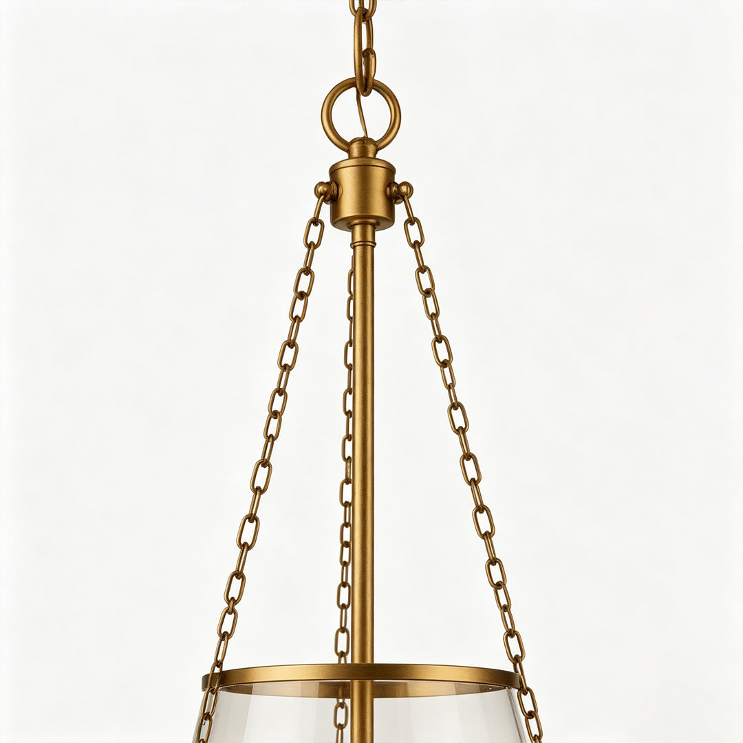 Glass candle chandelier close-up showing clear glass shade and candle-style bulb arrangement.
