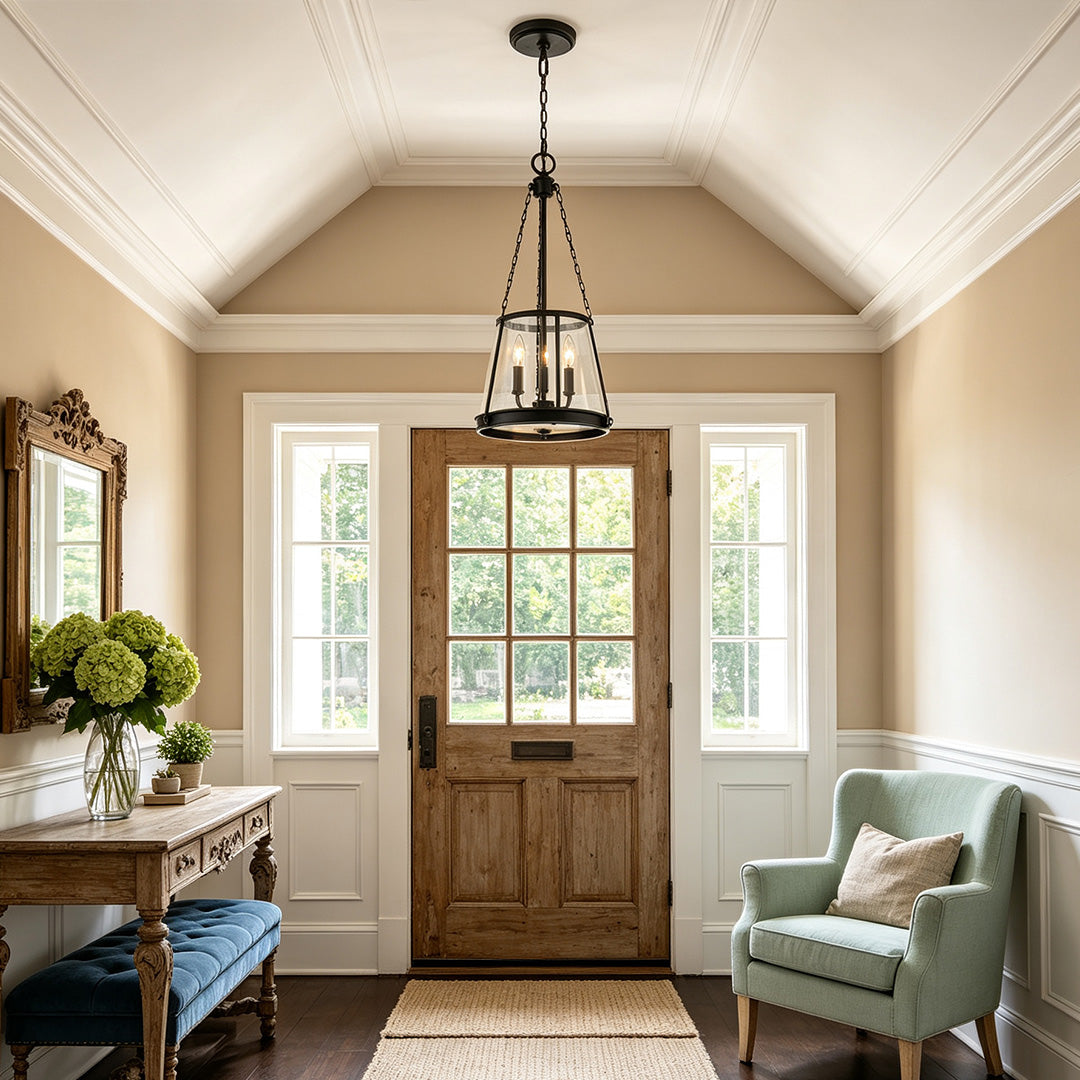 Glass candle chandelier displayed in an entryway with vaulted ceiling and neutral-toned interior design.
