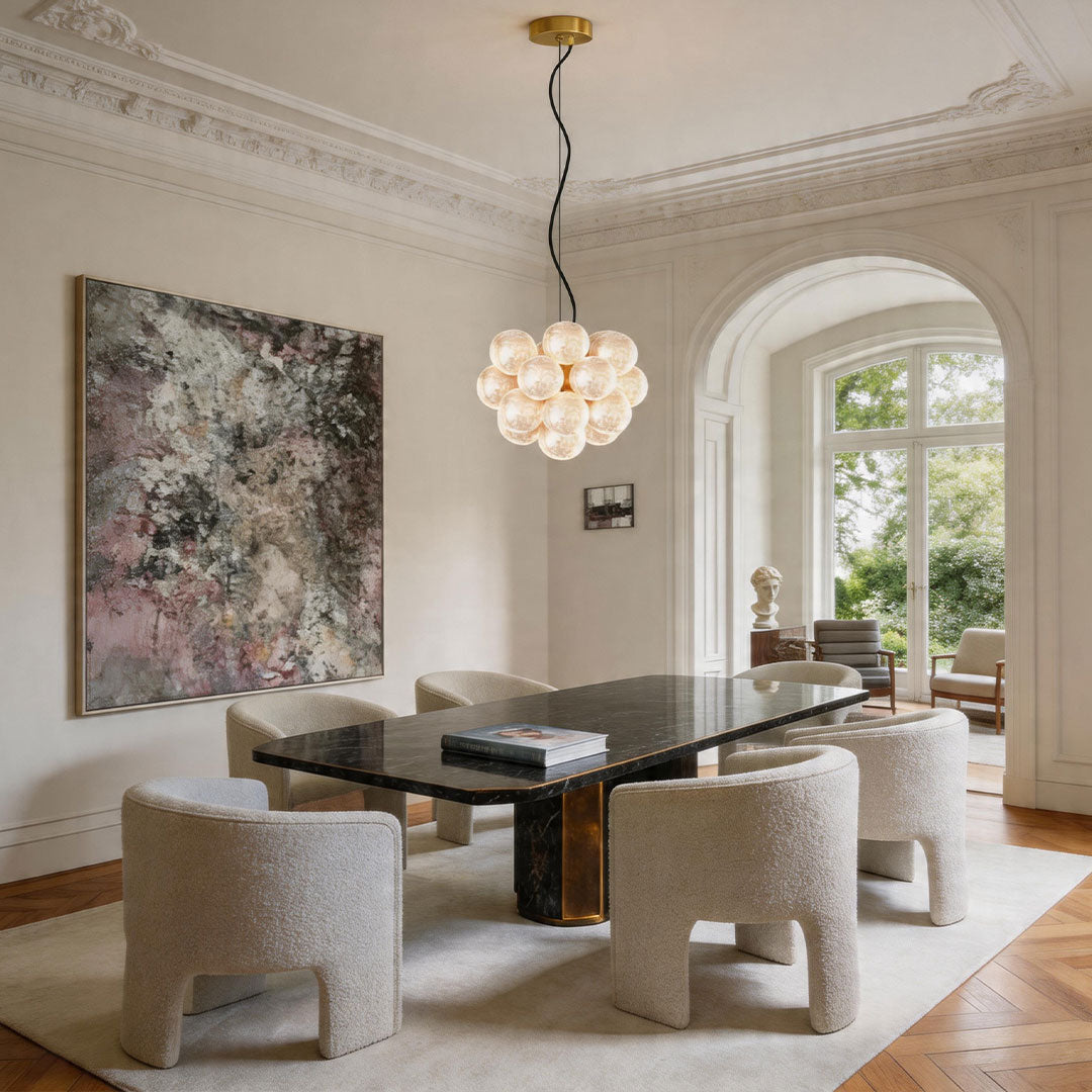 Elegant glass ceiling light fixture in dining room with warm ambient lighting.