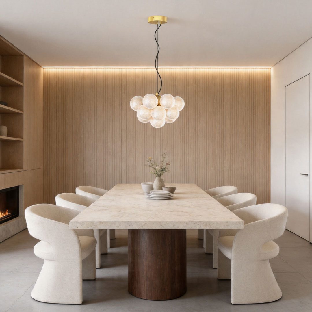 Contemporary glass ceiling light above dining table in modern interior.