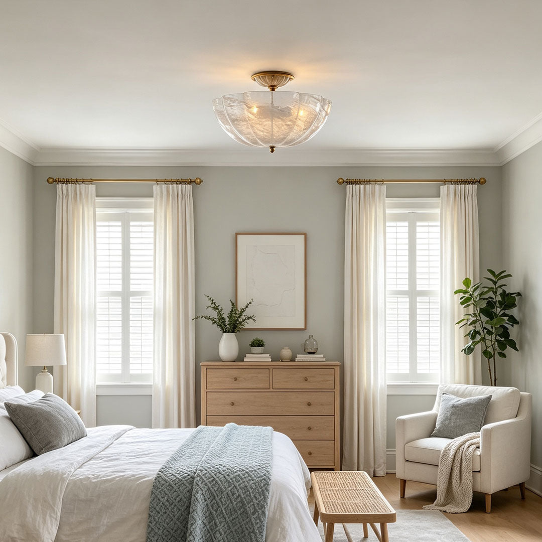 Glass ceiling lights installed in a cozy bedroom with elegant warm ambient illumination.