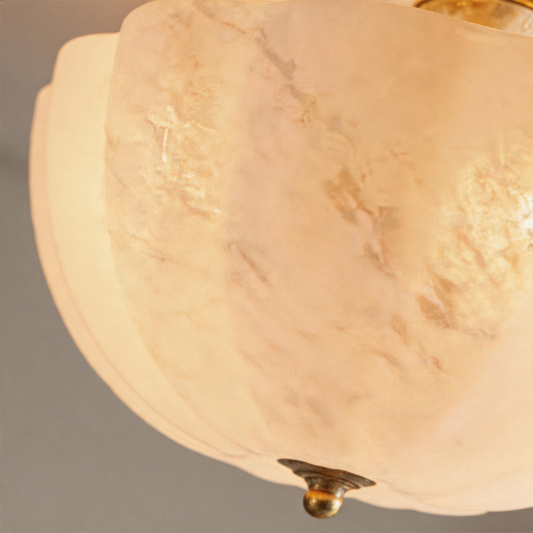 Glass ceiling lights close-up showing translucent alabaster style glass texture and brass accents.