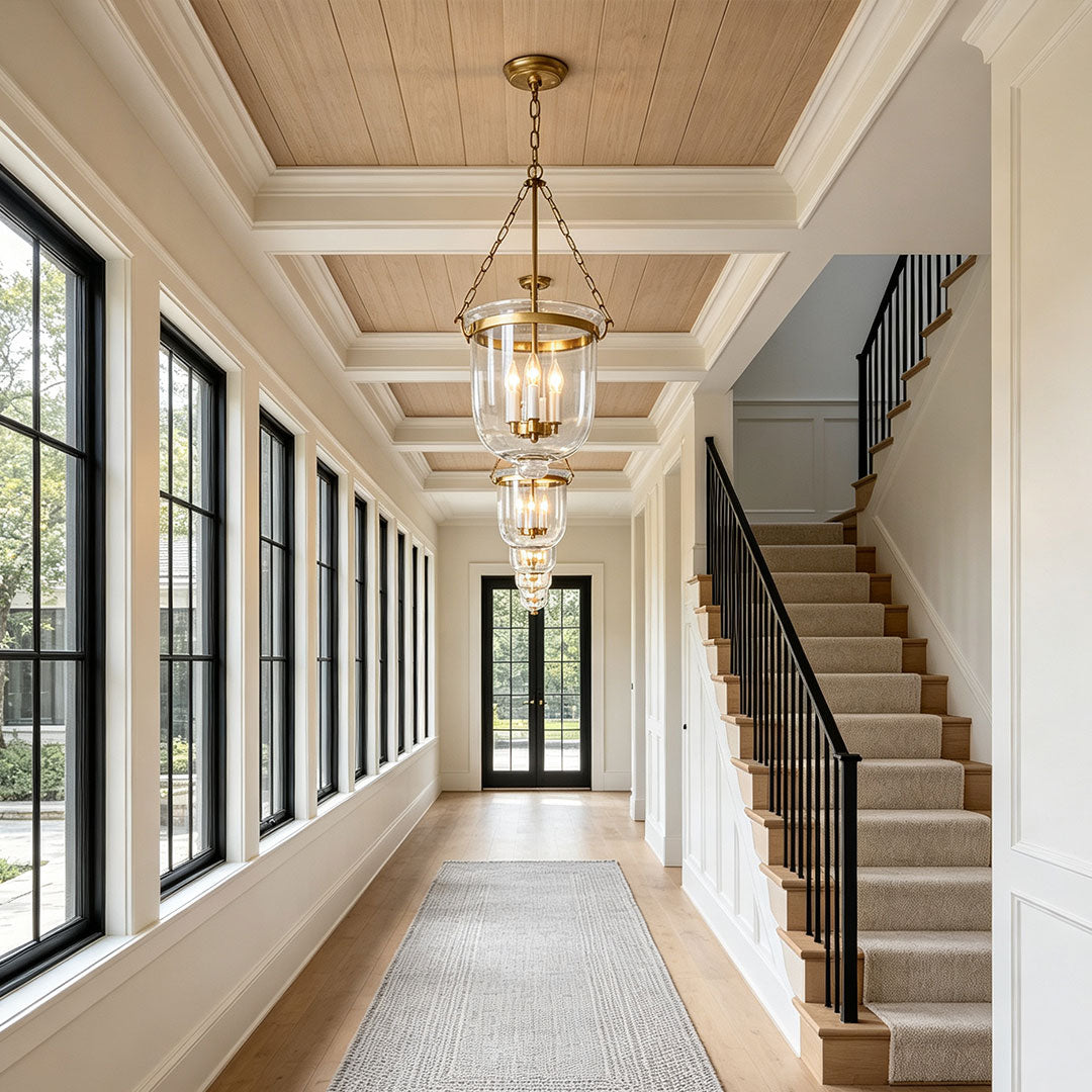 Glass chandeliers for dining room installed along a bright corridor with classic architectural details.