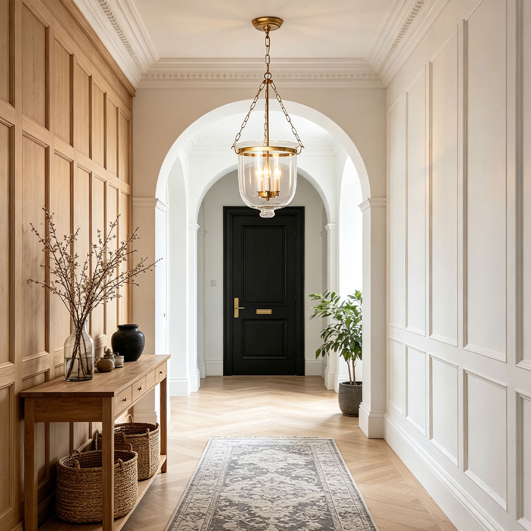 Glass chandeliers for dining room displayed in a refined hallway with warm luxury lighting accents.